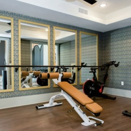 fitness center with open spaces and bright lighting through the windows